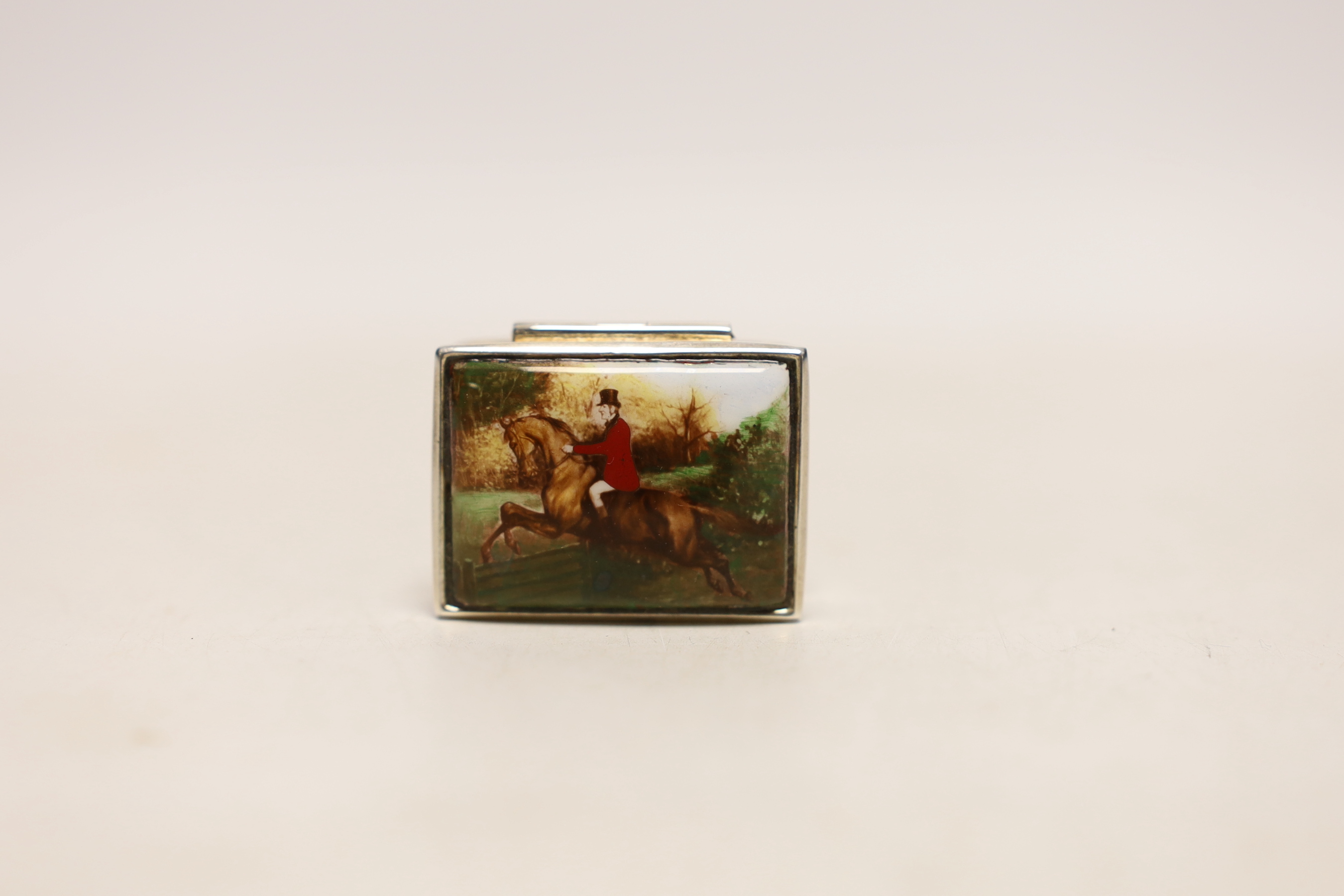 A modern 925 and enamel pill box, decorated with fox hunting scene, 36mm.